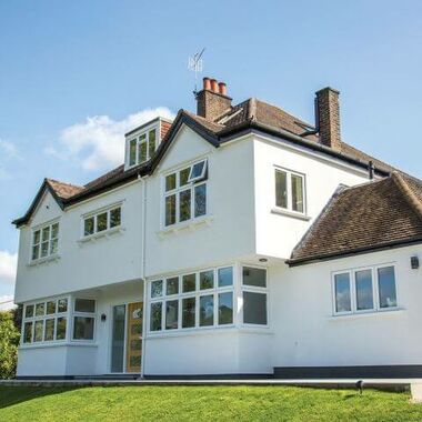 Homeowner house with white casement windows