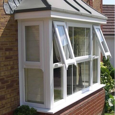 Mock sash horn bay window with top hung in white