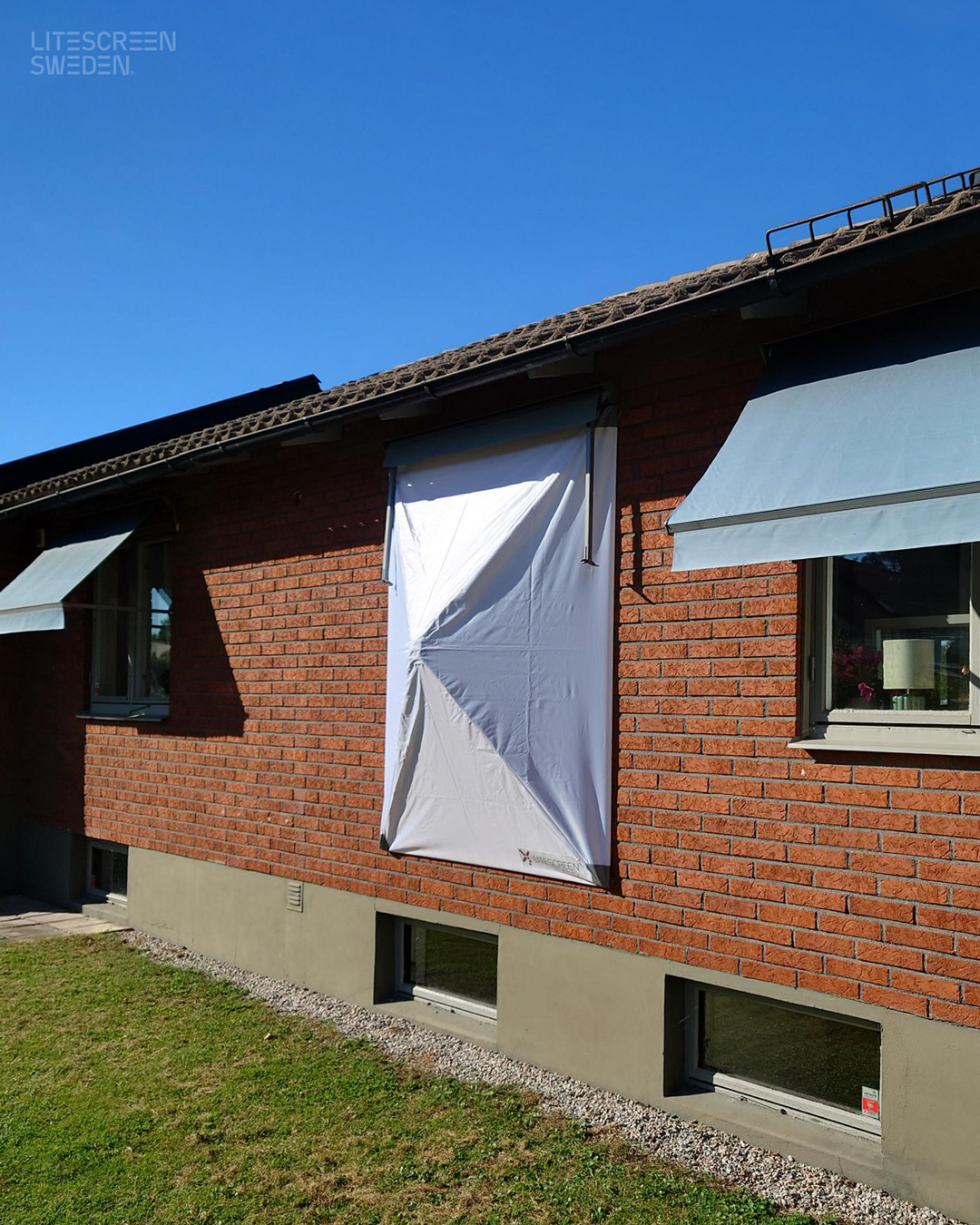 litescreen backsteinhaus fenster wetterschutz